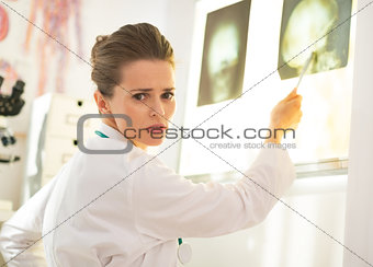 Doctor woman pointing on lightbox