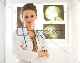 Portrait of doctor woman in front of lightbox