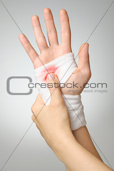 Injured hand with bloody bandage