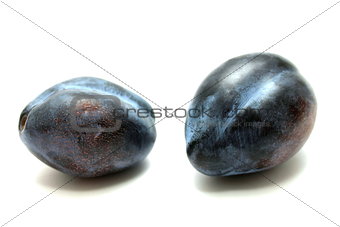 Fresh plums isolated on white background