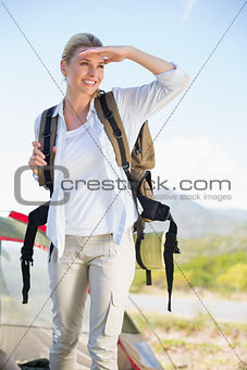 Attractive hiking blonde looking around her
