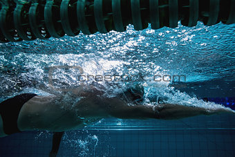 Fit swimmer training on his own