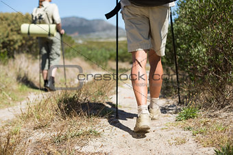 Hiking couple walking on country trail
