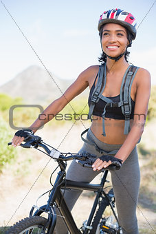 Fit woman going for bike ride