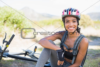 Fit woman taking a break on her bike ride