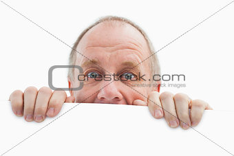 Mature man looking over card