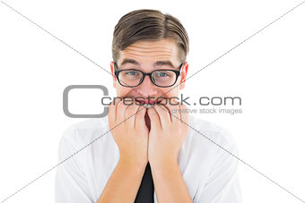Geeky businessman looking nervously at camera