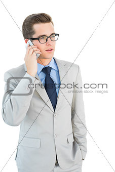 Geeky businessman talking on cellphone