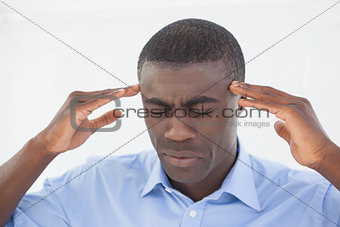 Stressed businessman getting a headache