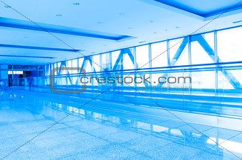 corridor structure with glass walls in blue