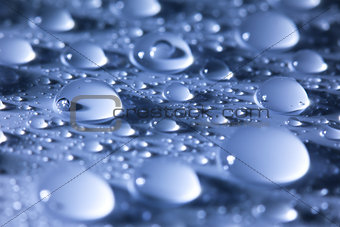 Water droplets  blue abstract background -- super macro 