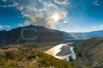 bright sun above the valley of the river Katun, Altai