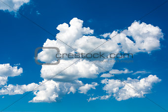 white clouds on the blue sky in summer day