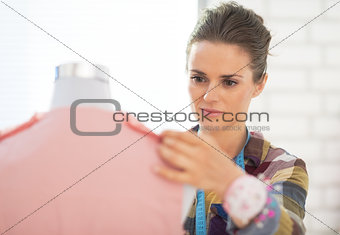 Tailor woman working in studio