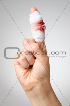 Injured finger with bloody bandage