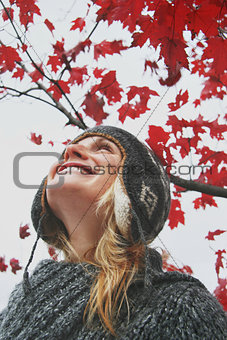 Woman looking at the autumn sky