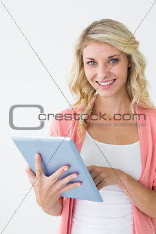 Beautiful young woman using digital tablet