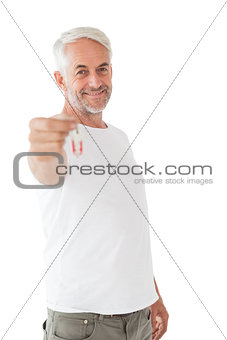 Happy mature man holding new house key