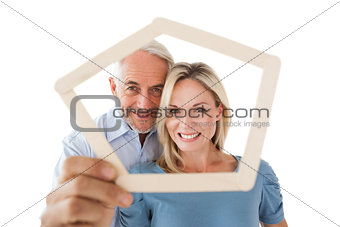 Mature couple looking through frame