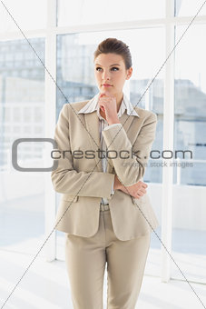 Pretty businesswoman looking to future