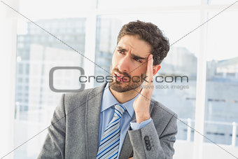 Businessman suffering from a headache