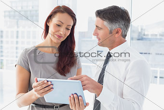 Business people holding a tablet