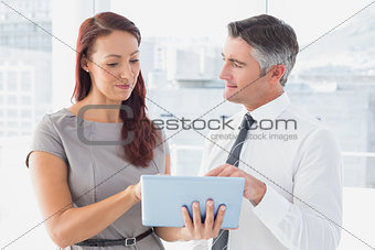 Business people holding a tablet