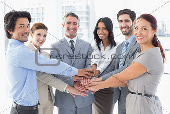 Business team stacking their hands