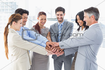 Business team stacking their hands