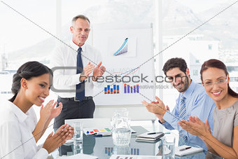 Business people applauding at meeting