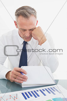 Businessman looking over his notes