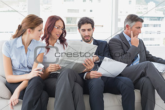 Business team reviewing work notes