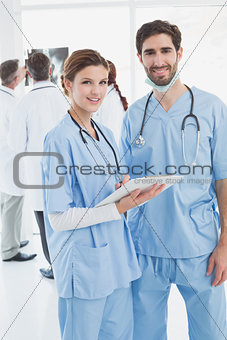 Nurses holding a file together