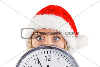 Festive blonde showing a clock