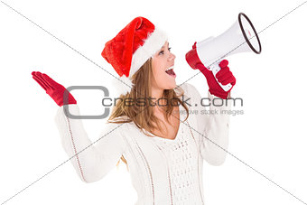 Festive blonde shouting through megaphone