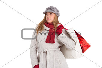 Happy blonde in winter clothes posing