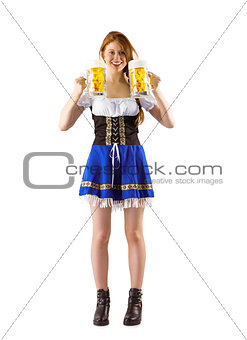 Oktoberfest girl holding jugs of beer