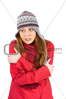 Cold redhead wearing coat and hat