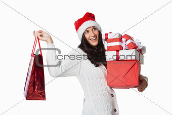 Smiling woman with christmas presents