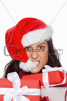 Irritated woman with christmas presents
