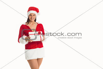 Woman smiling with christmas present