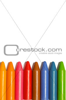 Colourful crayons in a row
