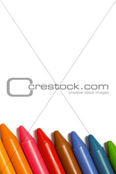 Colourful crayons in a row