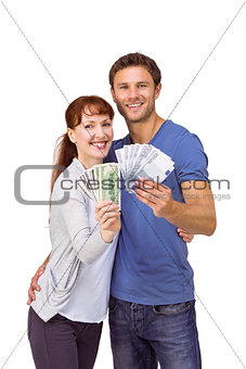 Couple holding fans of cash