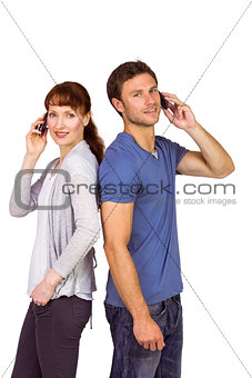 Couple both making phone calls
