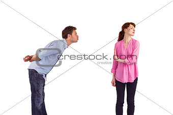 Woman stopping man from kissing