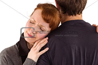 Scared woman holding onto man