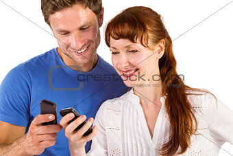 Couple using their mobile phones