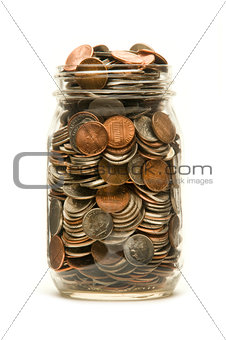 Glass jar overflowing with American coins