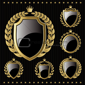 set of vector golden emblem with shield and wreaths